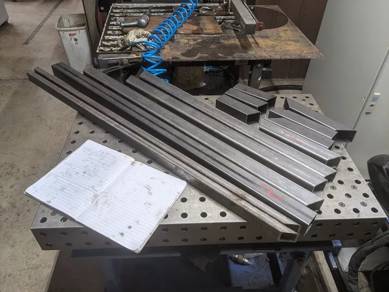 many parallel box steel sections with angles cut