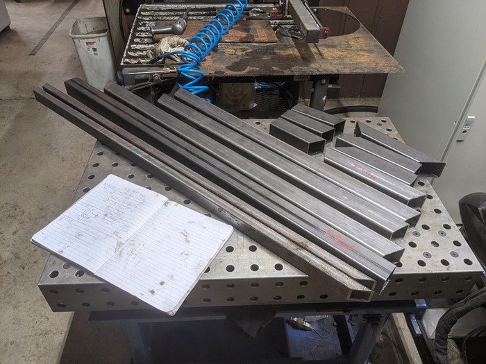 many parallel box steel sections with angles cut