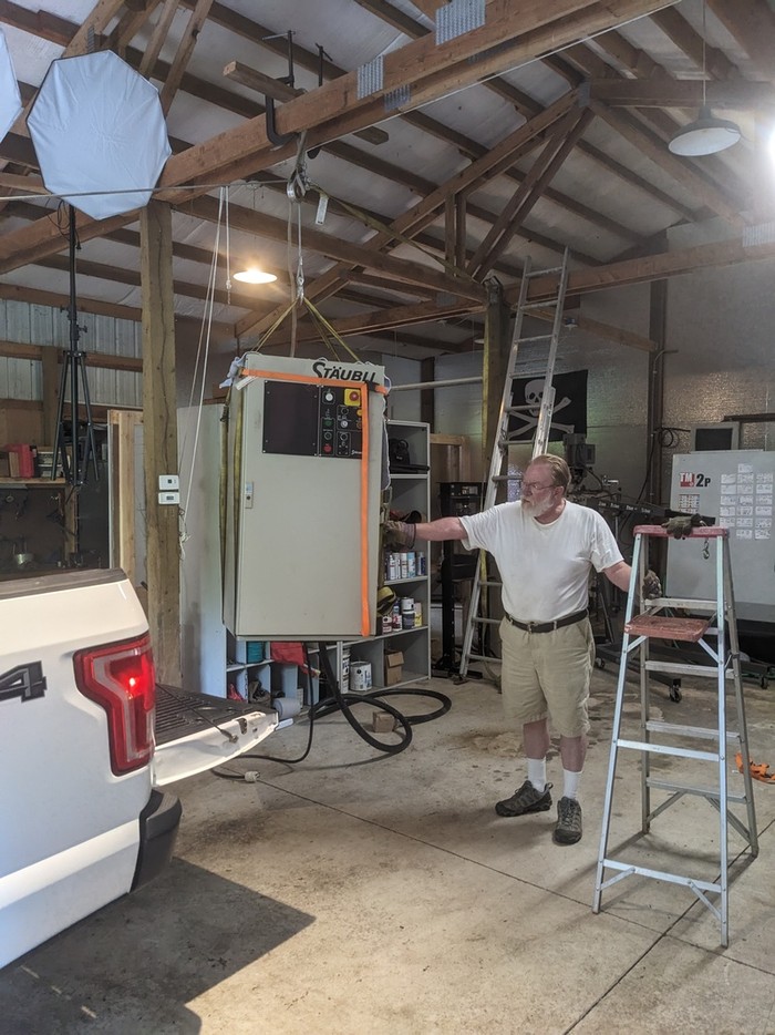 dad stabilizing the control as it is lifted