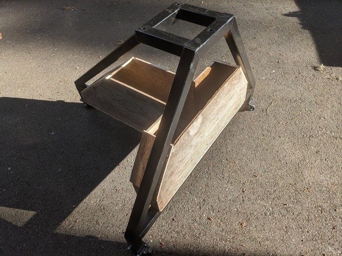 fat T shaped plywood form sitting in the frame