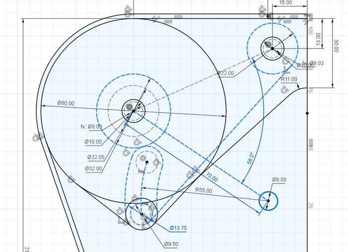 A series of dotted lines describing the path of the motor as it winds and unwinds belt from a spool