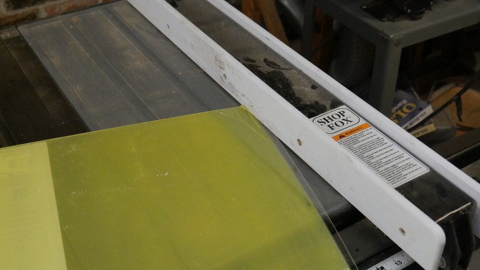 Sheet sliding under fence